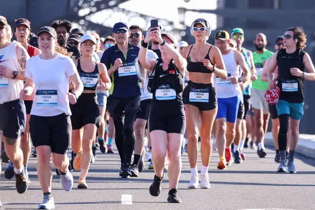 Competitors run across the Sydney Harbour Bridge during the 2023 Sydney Marathon on September 17, 2023 in Sydney, Australia. (Photo by Jenny Evans/Getty Images)