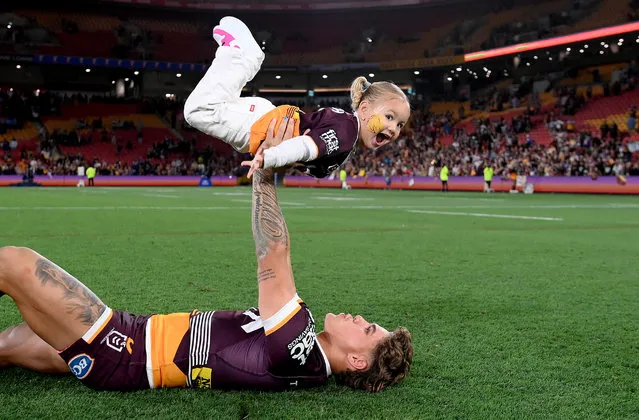 Reece Walsh of the Broncos celebrates with his daughter Leila after winning the NRL Preliminary Final match between the Brisbane Broncos and New Zealand Warriors at Suncorp Stadium on September 23, 2023 in Brisbane, Australia. (Photo by Bradley Kanaris/Getty Images)
