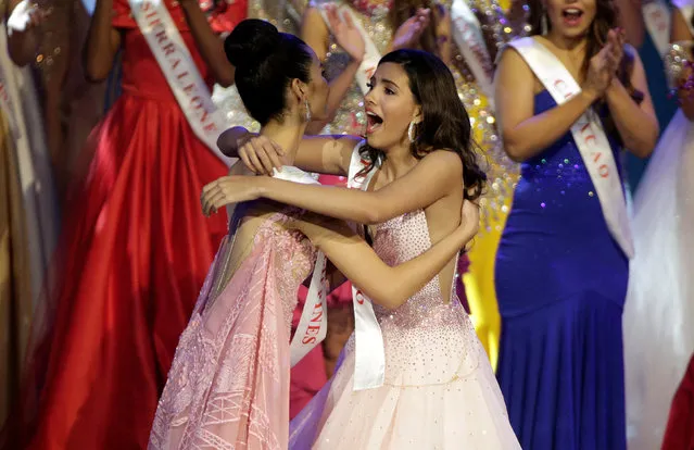 Miss Puerto Rico Stephanie Del Valle (R) is hugged by Miss Philippines Catriona Elisa Gray after winning the Miss World 2016 Competition in Oxen Hill, Maryland, U.S., December 18, 2016. (Photo by Joshua Roberts/Reuters)