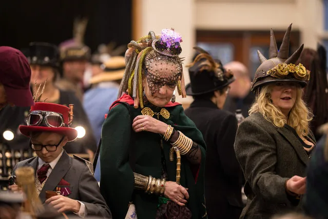 Steampunk enthusiasts peruse the trade stalls in Haworth Village Hall as they attend the sixth annual Haworth Steampunk Weekend in Haworth, northern England on November 25, 2018. (Photo by Oli Scarff/AFP Photo)