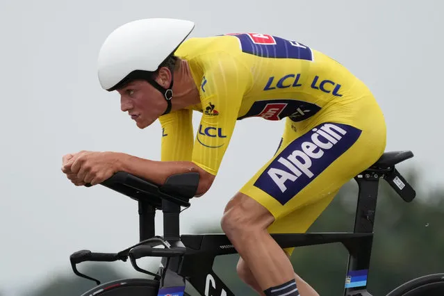 Netherland's Mathieu Van Der Poel, wearing the overall leader's yellow jersey, competes during the fifth stage of the Tour de France cycling race, an individual time-trial over 27.2 kilometers (16.9 miles) with start in Change and finish in Laval Espace Mayenne, France, Wednesday, June 30, 2021. (Photo by Daniel Cole/AP Photo)