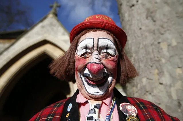 The clown “Mr. Woo” arrives at the All Saints Church before the Grimaldi clown service in Dalston, north London, February 7, 2016. (Photo by Peter Nicholls/Reuters)