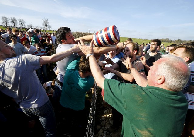 Players battle for the bottle during the bottle-kicking game in Hallaton, central England April 6, 2015. (Photo by Darren Staples/Reuters)