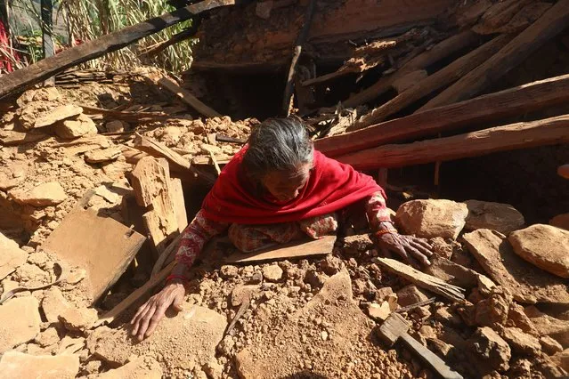 An earthquake survivor from Rukum West in Mid-Western Nepal shows the spot from where she was pulled alive from rubble on November 7, 2023. Thousands of people have been rendered homeless after a 6.4 Richter scale earthquake struck the Mountainous region on November 3, 2023. (Photo by Aryan Dhimal/ZUMA Press Wire/Rex Features/Shutterstock)