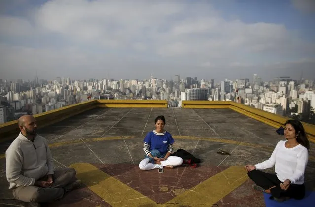 People meditate on the helipad of Copan building to celebrate World Health Day, which was observed on April 7, in downtown Sao Paulo April 9, 2015. (Photo by Nacho Doce/Reuters)