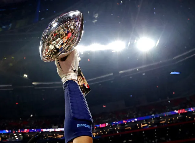 The New England Patriots celebrates with the Vince Lombardi Trophy after beating the Los Angeles Rams in Super Bowl LIII at Mercedes-Benz Stadium on February 3, 2019 in Atlanta, GA, USA. (Photo by Matthew Emmons/USA TODAY Sports)