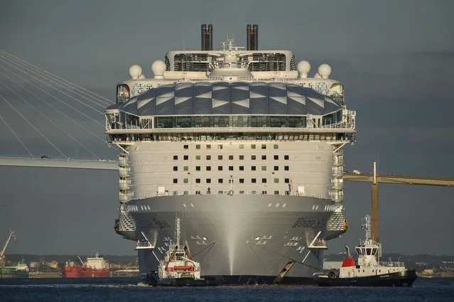 This photograph taken on November 5, 2021 shows American operator Royal Caribbean Cruise ship (RCCL) new cruise ship “Wonder of the seas” leaving the “Chantiers de l'Atlantique” shipyard in Saint-Nazaire, western France, heading for Marseille's harbour. (Photo by Sebastien Salom-Gomis/AFP Photo)