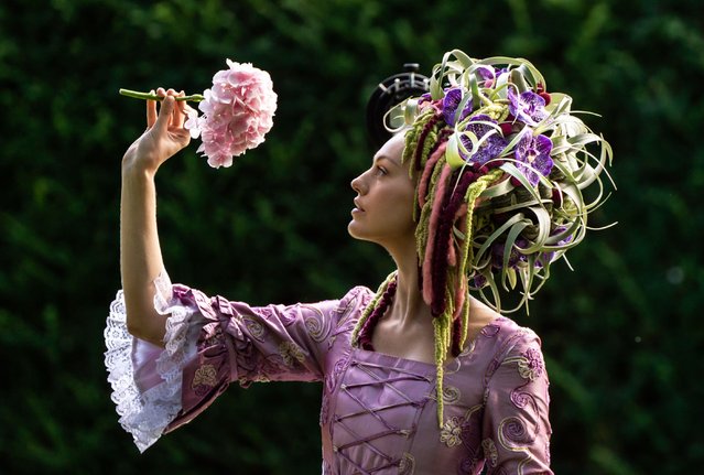 Gemma Sadler models a fabulous Georgian costume, including a wig made from flowers and foliage created by Florist of the Year Helen James, during the staging day for the 2021 Harrogate Autumn Flower Show at Newby Hall, near Ripon, United Kingdom on Thursday, September 16, 2021. (Photo by Danny Lawson/PA Images via Getty Images)