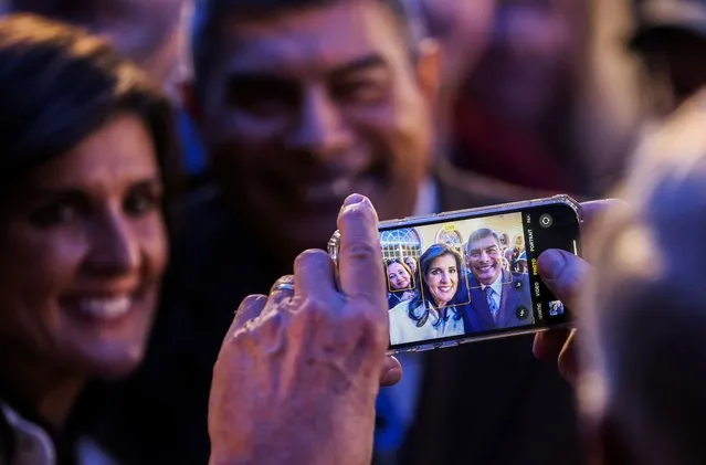 Republican presidential candidate and former U.S. Ambassador to the United Nations Nikki Haley is photographed with a supporter during a campaign event in Rock Hill, South Carolina, U.S., February 18, 2024. (Photo by Sam Wolfe/Reuters)