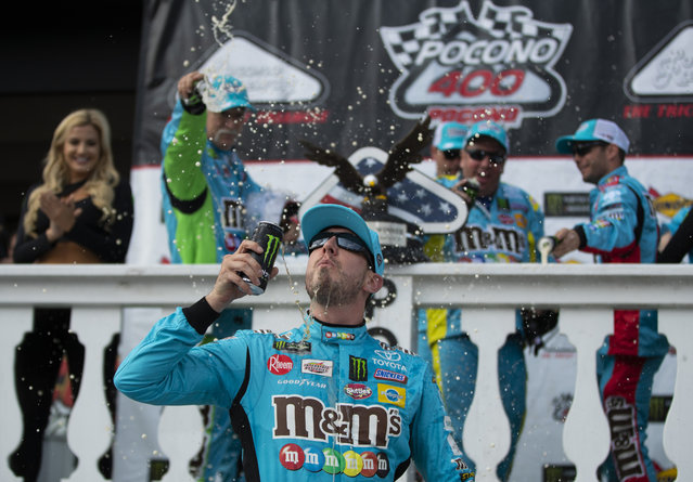 Kyle Busch celebrates in victory lane after winning a NASCAR Cup Series auto race at Pocono Raceway, Sunday, June 2, 2019, in Long Pond, Pa. (Photo by Matt Slocum/AP Photo)