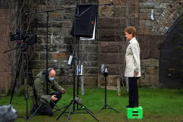 Scotland's First Minister and leader of the Scottish National Party (SNP), Nicola Sturgeon waits for the camera technician as she launches the SNP virtual electoral campaign in Partick in the West End of Glasgow, Scotland on March 31, 2021, ahead of the upcoming  Scottish Parliament election which is to be held on May 6, 2021. (Photo by Andy Buchanan/Pool via AFP Photo)