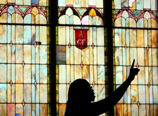 A woman sings during an Easter service held at Bethel A.M.E. Church in downtown Scranton, Pa., on Sunday, March 27, 2016. (Photo by Butch Comegys/The Times & Tribune via AP Photo)