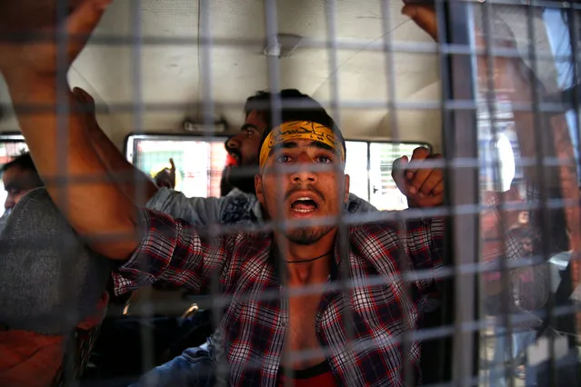A Kashmiri Shiite Muslim shouts slogans from Indian police vehicle after was detained during a Muharram procession in Srinagar, India, 08 September 2019. Authorities imposed restrictions in parts of Srinagar to prevent Shia Muslims from taking part in mourning processions on the eighth day of the Islamic holy month of Muharram. According to local news reports, the government banned 8th, 9th and 10th Muharram processions across Srinagar as the shutdown continues for 35th consecutive day in Kashmir. Tensions were renewed in Kashmir after the Indian government on 05 August removed the special constitutional status granted to the region. (Photo by Farooq Khan/EPA/EFE)