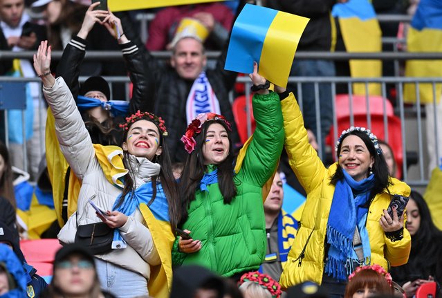 Ukraine supporters cheer ahead of the UEFA Euro 2024 group C qualification football match between England and Ukraine at Wembley Stadium in London on March 26, 2023. (Photo by Glyn Kirk/AFP Photo)