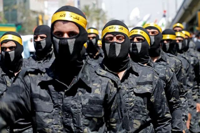 Iraqi Shi'ite Muslims march during a parade marking the annual al-Quds Day (Jerusalem Day) on the last Friday of the Muslim holy month of Ramadan in Baghdad, Iraq on May 31, 2019. (Photo by Thaier al-Sudani/Reuters)