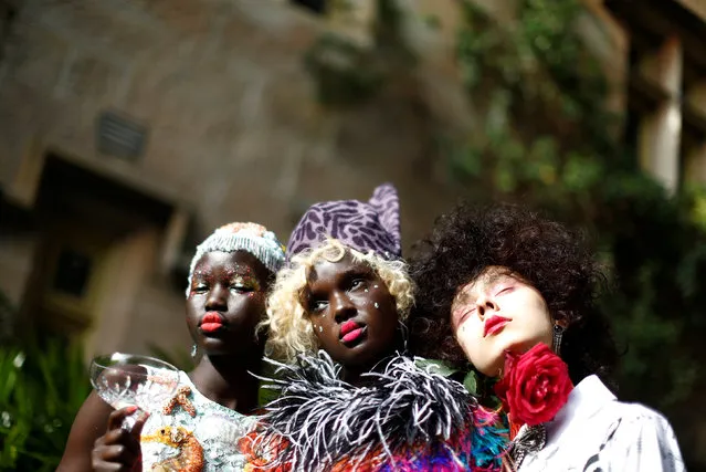 Models pose against the backdrop of an old sandstone chapel during a fashion show for the label Romance Was Born on the waterfront of Sydney Harbour during Australian Fashion Week, Sydney, Australia May 18, 2016. (Photo by Jason Reed/Reuters)