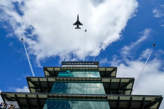 The U.S. Air Force Thunderbirds perform a flyover before the Indianapolis 500 auto race at Indianapolis Motor Speedway in Indianapolis, Sunday, May 26, 2024. (Photo by AJ Mast/AP Photo)