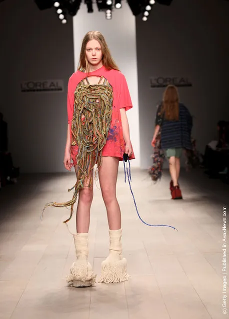 A model walks the runway during the Central Saint Martins MA Fashion show featuring student Luke Brooks at London Fashion Week Autumn/Winter 2012