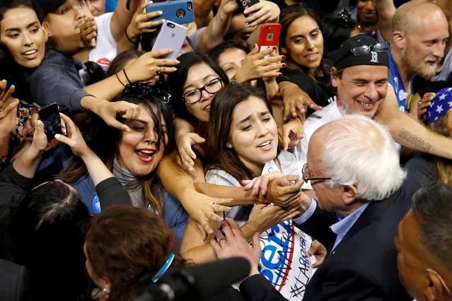 Supporters greet Democratic presidential candidate Bernie Sanders at a rally in Carson, California, U.S., May 17, 2016. (Photo by Lucy Nicholson/Reuters)
