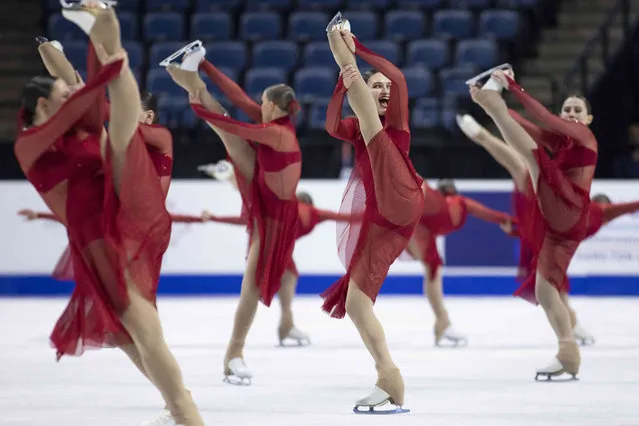Members of Team Ice Fire Senior from Poland compete in the free skate during the International Skating Union World Synchronized Skating Championships in Hamilton, Ontario, Saturday, April 9, 2022. (Photo by Nick Iwanyshyn/The Canadian Press via AP Photo)
