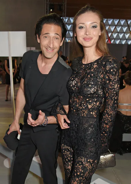 Adrien Brody (L) and Lara Lieto attend the Fashion for Relief event during the 70th annual Cannes Film Festival at Aeroport Cannes Mandelieu on May 21, 2017 in Cannes, France. (Photo by David M Benett/Getty Images)
