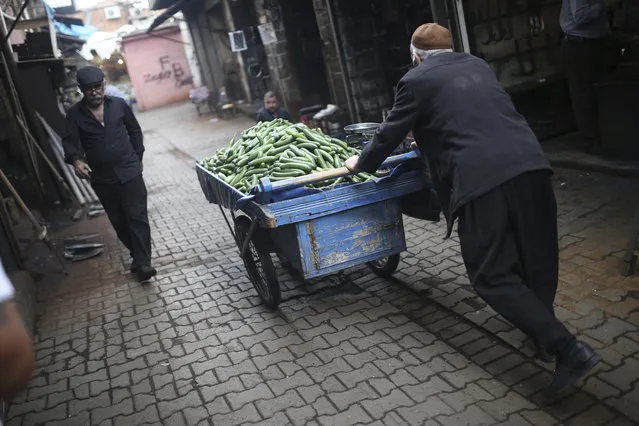 A street vendor pushes a cart in Diyarbakir, Turkey, Monday, April 17, 2017. Turkey's main opposition party urged the country's electoral board Monday to cancel the results of a landmark referendum that granted sweeping new powers to the nation's president, citing what it called substantial voting irregularities. (Photo by Emre Tazegul/AP Photo)