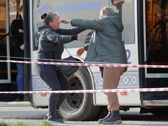 Azovstal steel plant employee Valeria (R), last name withheld, evacuated from Mariupol, hugs her sister Aleksandra as they meet at a temporary accommodation centre during Ukraine-Russia conflict in the village of Bezimenne in the Donetsk Region, Ukraine on May 1, 2022. (Photo by Alexander Ermochenko/Reuters)