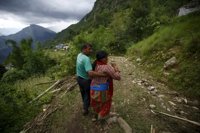 A family member cries after a dead body is recovered from the landslide at Lumle village in Kaski district July 30, 2015. (Photo by Navesh Chitrakar/Reuters)