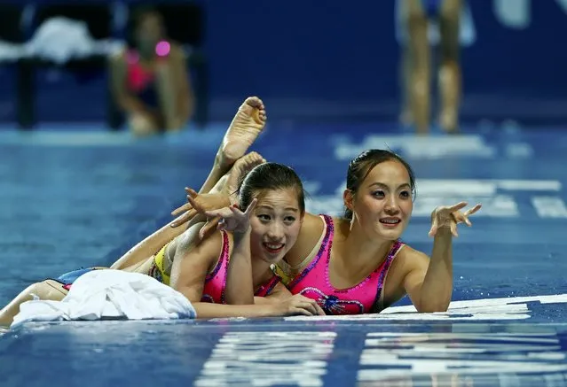 Members of Team North Korea pose for photographs after the women's synchronised swimming free routine combination final at the Aquatics World Championships in Kazan, Russia August 1, 2015. (Photo by Michael Dalder/Reuters)