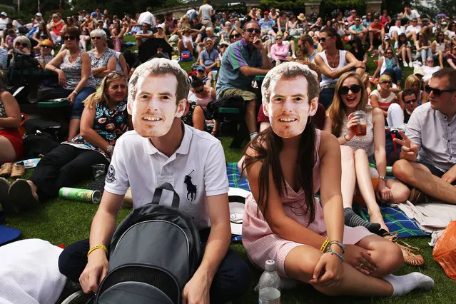 Fans of Andy Murray gather on “Murray Mount” to watch the Gentlemen's Singles first round match between Andy Murray of Great Britain and David Goffin of Belgium on day one of the Wimbledon Lawn Tennis Championships at the All England Lawn Tennis and Croquet Club at Wimbledon on June 23, 2014 in London, England. (Photo by Dan Kitwood/Getty Images)