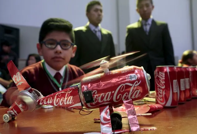 A student presents a helicopter built with recycled Coca-Cola cans during the annual robotics fair supported by the Bolivian Education Ministry in La Paz, August 10, 2015. (Photo by David Mercado/Reuters)