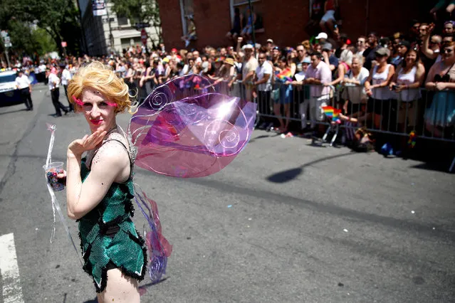 Participants take part in the annual NYC Pride parade in New York City, New York, U.S., June 26, 2016. (Photo by Brendan McDermid/Reuters)