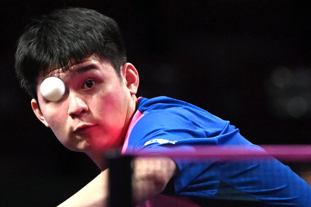 China's Lin Shidong eyes the ball as he plays against Spain's Alvaro Robles during their men's singles round of 32 table tennis match of the World Table Tennis (WTT) Champions Montpellier 2024 at the Sud de France Arena in Perols, near Montpellier, southern France, on October 23, 2024. (Photo by Sylvain Thomas/AFP Photo)