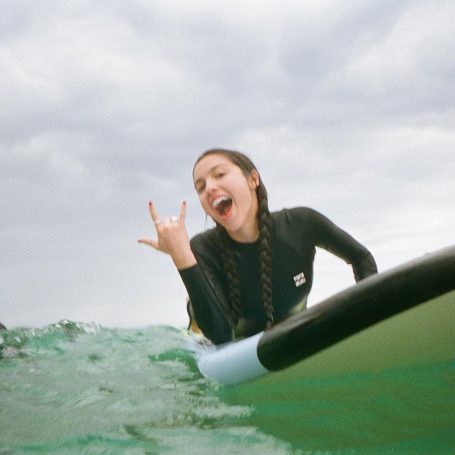 American singer-songwriter Olivia Rodrigo rides a wave while on a break in Australia during her tour in the last decade of October 2024. (Photo by oliviarodrigo/Instagram)