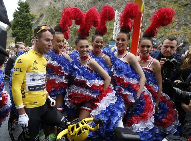 Cycling, Tour de France cycling race, The 183-km (113 miles) Stage 2 from Saint-Lo to Cherbourg-en-Contentin, France on July 3, 2016. Team Dimension Data rider Mark Cavendish of Britain poses with French Cancan performers at the start of the stage. (Photo by Juan Medina/Reuters)