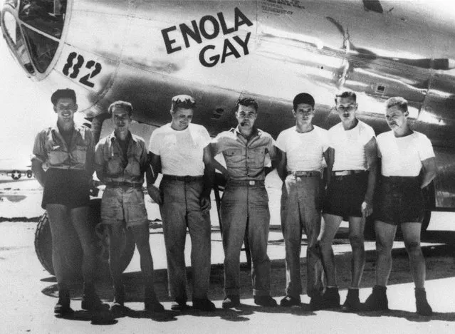 American bomber pilot Paul W. Tibbets Jr. (center) stands with the ground crew of the bomber “Enola Gay” which Tibbets flew in the atomic bombing of Hiroshima, Tinian Island, Northern Marianas, August 1945. Ground crew includes (left to right) engine mechanic Private Harold Olsen, Corporal John Jackson, crew chief Staff Sergeant Walter McCaleb, Tibbets, engine mechanic Sergeant Leonard Markley, engine mechanic Sergeant Jean Cooper, engine mechanic Private John Lesnieski. About 120,000 people were killed outright by just one atomic bomb (called “Little Man”) and nearly a quarter million over time from injuries and radiation effects. (Photo by AP Photo)