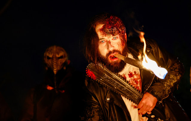 A person in a Halloween-themed costume attends the Zombie Walk Event in Essen, Germany on October 31, 2024. (Photo by Leon Kuegeler/Reuters)