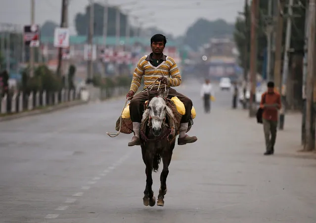 A man rides a pony during a curfew in Srinagar July 15, 2016. (Photo by Danish Ismail/Reuters)