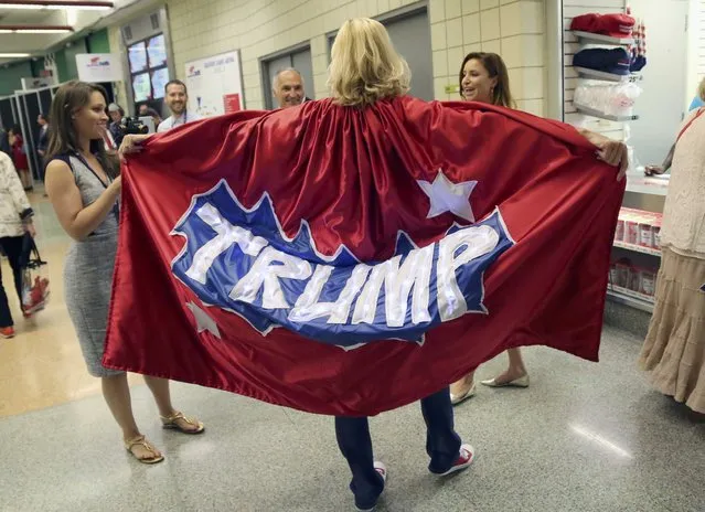 A man wearing a Trump cape talks to people during the second day of the Republican National Convention in Cleveland, Ohio, U.S. July 19, 2016. (Photo by Aaron Josefczyk/Reuters)