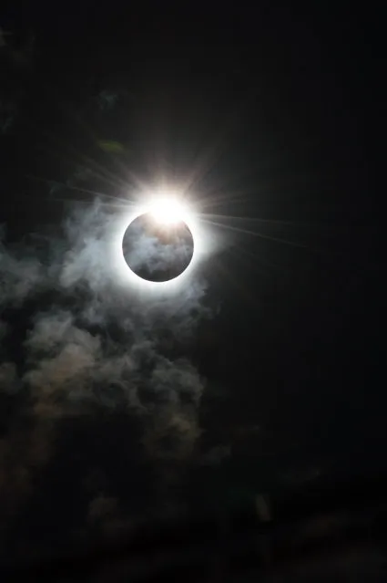 “The Diamond Ring”. The dramatic moment that our star, the sun, appears to be cloaked in darkness by the moon during the Total Solar Eclipse of 9th March 2016 in Indonesia. The sun peers out from behind the moon and resembles the shape of a diamond ring, caused by the rugged edge of the moon allowing some beads of sunlight to shine through in certain places. (Photo by Melanie Thorne/Royal Observatory Greenwich’s Astronomy Photographer of the Year 2016/National Maritime Museum)