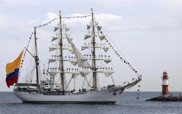 The Columbian Navy sailing school ship “Gloria” arrives the harbor in Warnemuende, near Rostock, northern Germany, Thursday, August 8, 2019. 170 ships from a variety of countries took part in the annual traditional sailing reunion known as “Hanse Sail”. (Photo by Bernd Wuestneck/dpa via AP Photo)