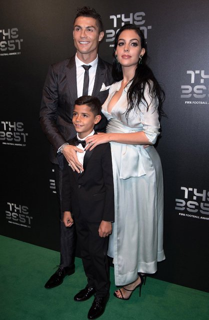 Real Madrid forward Cristiano Ronaldo (L), his girlfriend Georgina Rodriguez (R) and his son Cristiano Ronaldo Jr. arrive for the The Best FIFA 2017 Awards at the Palladium Theatre in London, England on October 17, 2017. (Photo by Philip Rock/Anadolu Agency/Getty Images)