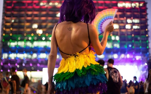 Hundreds of LGBT members and supporters attend a gay pride rally under strict health restrictions due to the coronavirus outbreak in Tel Aviv, Israel, Sunday, June 28, 2020. The rally has been down-scaled amid the coronavirus outbreak in Tel Aviv, which last year drew more than 250,000 people. (Photo by Oded Balilty/AP Photo)