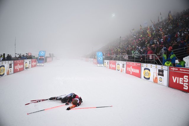 Germany's Roman Rees reacts after crossing the finish line of the men's 15km short individual event of the IBU Biathlon World Cup in Antholz-Anterselva, Italy, on January 18, 2024. (Photo by Marco Bertorello/AFP Photo)