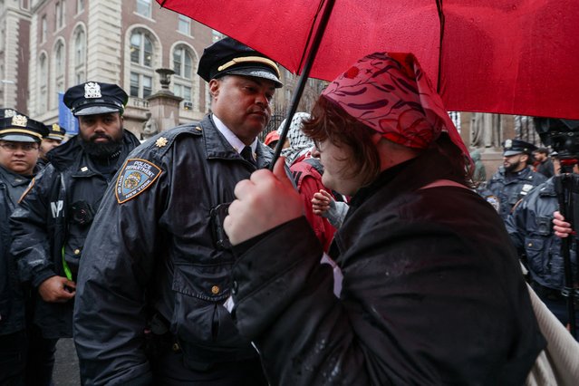 A police officer confronts a student during a picket outside Columbia University on the first day of classes since the university announced policy changes in response to U.S. President Donald Trump's administration demands in New York City on March 24, 2025. (Photo by Kylie Cooper/Reuters)