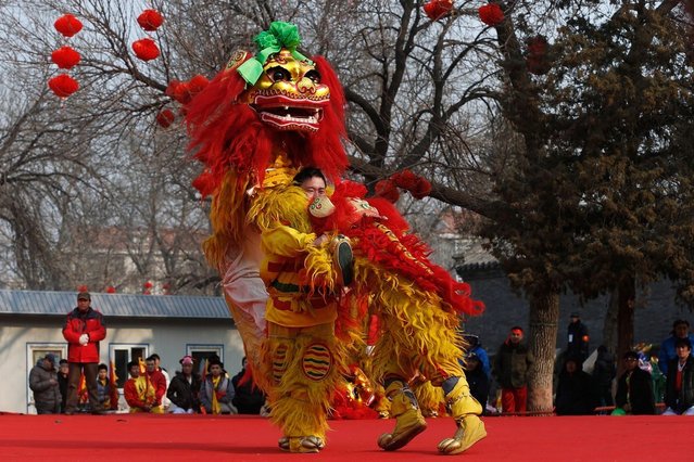 Chinese folk artists perform during the opening ceremony of the Spring Festival Temple Fair at Dragon Lake Park on February 9, 2013 in Beijing, China.The Chinese Lunar New Year of Snake also known as the Spring Festival, which is based on the Lunisolar Chinese calendar, is celebrated from the first day of the first month of the lunar year and ends with Lantern Festival on the Fifteenth day.  (Photo by Lintao Zhang)