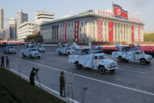 Trucks carry drones under a stand with North Korean leader Kim Jong Un and other officials during the parade celebrating the 70th anniversary of the founding of the ruling Workers' Party of Korea, in Pyongyang, October 10, 2015. (Photo by James Pearson/Reuters)
