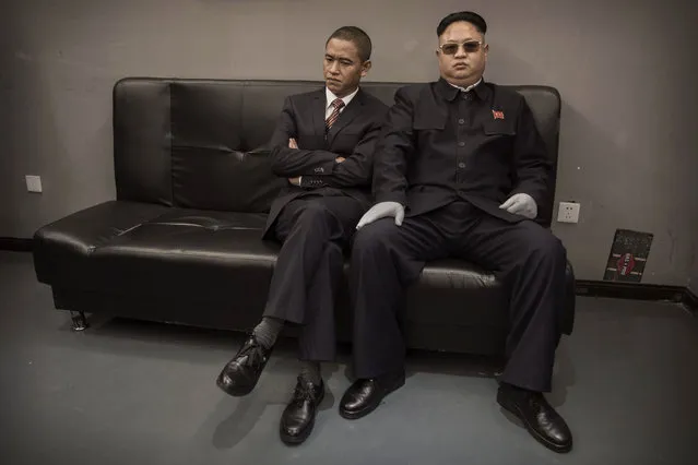 Chinese actor and United States President Barack Obama impersonator Xiao Jiguo (L) and North Korean leader Kim Jung Un impersonator Jia Yongtang wait before a brief appearance together on a film set on October 20, 2015 in Beijing, China. (Photo by Kevin Frayer/Getty Images)