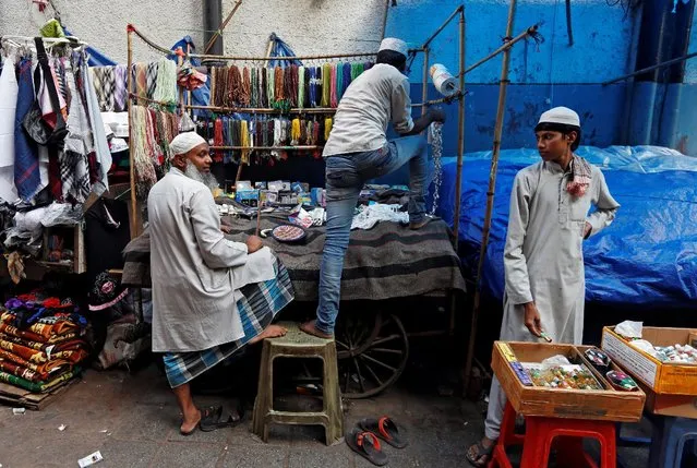 A street vendor sets up his stall outside the Nizamuddin Dargah, a shrine of Sufi saint Hazrat Nizamuddin Auliya, in New Delhi, India September 27, 2016. (Photo by Adnan Abidi/Reuters)