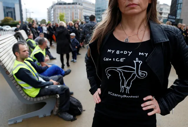 A demonstrator wears a shirt to protest against a proposed parliament bill to completely ban abortion in Poland, in front of European institutions in Brussels, Belgium, October 3, 2016. (Photo by Francois Lenoir/Reuters)
